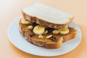 Peanut butter with bread and raspberry marmalade