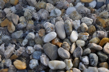 pebbles on the beach. Stones full frame background close up.