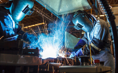 Welding with sparks worker with protective mask