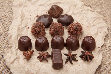 Chocolate candies various shape on apaper.