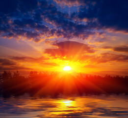 Obraz na płótnie Canvas sunset over lake water surface