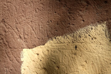 brown and yellow wall texture close-up natural light