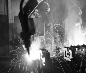 Robots welding in a car factory, Black&White.