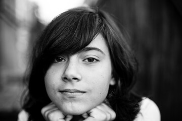 Close-up portrait of teen girl, black and white photo.