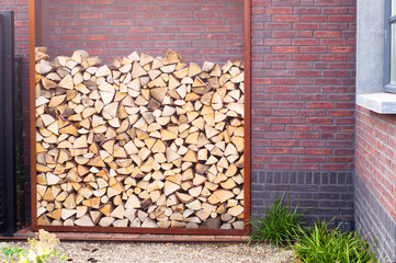 Stacked firewood outside for the fireplace