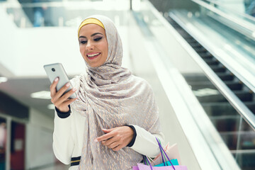 Young Arabian Woman Using Smartphone on Shopping.