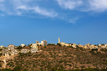 Modern urban architecture in Haifa, Israel. Fall season. Cityscape and skyline at sunset