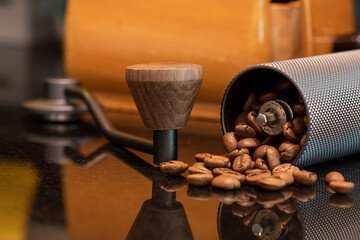 The barista is preparing coffee beans and dripping equipment.