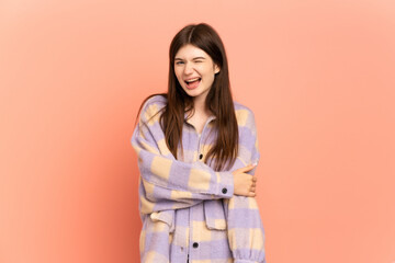 Fototapeta premium Young Ukrainian girl isolated on pink background laughing