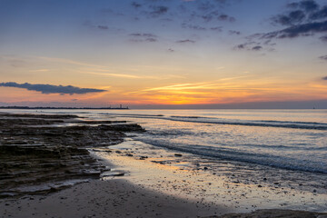 Fototapeta na wymiar sunset on the Atlantic coast of France on the Ile de with the Baleines Lighthouse behind