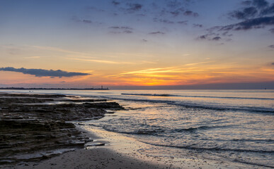 sunset on the Atlantic coast of France on the Ile de with the Baleines Lighthouse behind