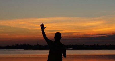 Fototapeta premium silhouette of a person at sunset