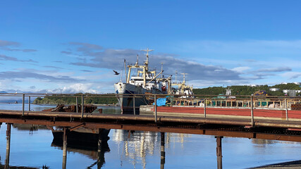 Old ship at the pier in the port. The seaport of Petropavlovsk-Kamchatsky.