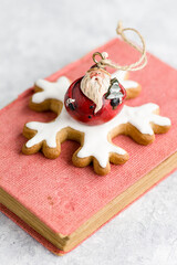 Small decoration of Santa Claus on the book.