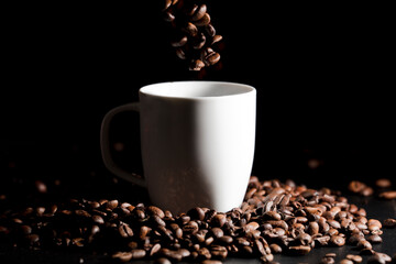 cup with coffee beans with black background