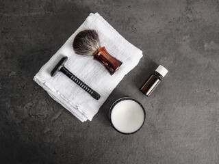 Set of grooming accessories on a concrete background, flat lay top view