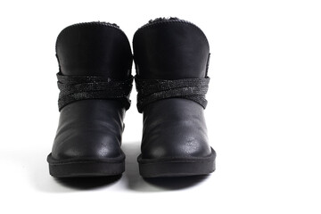 Black stylish winter boots with fur. Ugg boots. Isolated on a white background