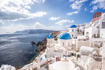 Fototapeta premium Oia village with churches against azure sea on Santorini island in Greece