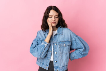 Teenager Ukrainian girl isolated on pink background with toothache