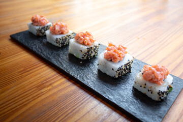 small sushi with salmon topping
