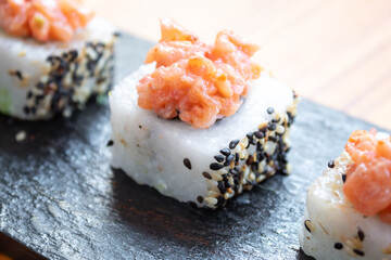 small sushi with salmon topping