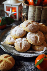 Winter festive baking. Homemade tangerine cookies, powdered sugar dressing.