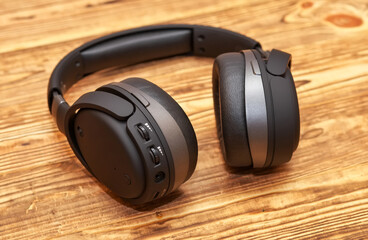 Headphones for gaming and listening music on a wooden background
