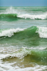 Vertical frame close-up shot green ocean sea waves