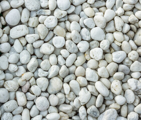 Bright white pebbles stones on a beach