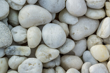 Bright white pebbles stones on a beach