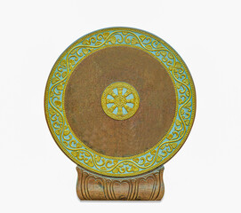 Thammachak wheel is carved from stone as a symbol of Buddhism