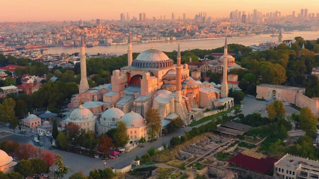 Istanbul, Hagia Sophia (Ayasofya) with a Golden Horn on the background at sunset. Aerial all-round view