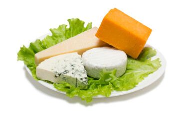 Variety of cheese on plate with green lettuce isolated on white background