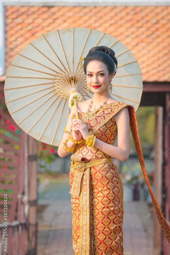 Wall mural luxury portrait of a beautiful thai girl in traditional thai costume, identity culture of thailand,  - Wall murals