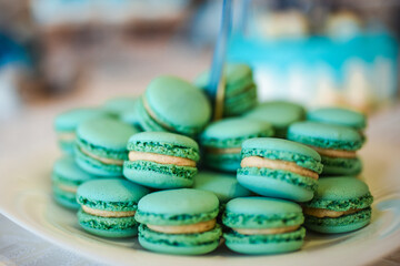 turquoise sweet macarons on a plate. Food candy. Colorfull delicious.