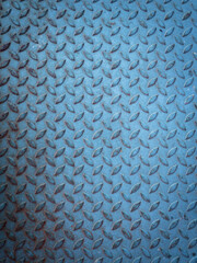 Blue steel plate texture grunge background with diamond pattern.