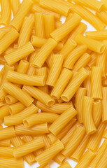 raw pasta close-up on white plate, upright position (italian pasta)
