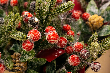 Christmas decor in the store, spruce branches with berries