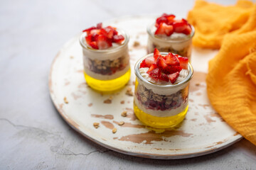 Dessert Parfait glass cup, with lemon jello, yogurt and fresh strawberries. 