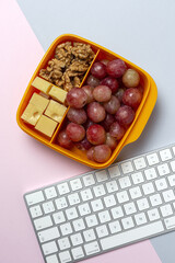 Food in Plastic containers ready to eat with Cheese, grapes and nuts