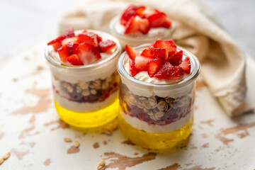 Dessert Parfait glass cup, with lemon jello, yogurt and fresh strawberries. 