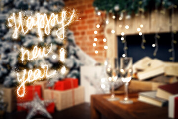 Happy New Year lettering with sparklers on background two glasses with champagne on the table against of New Year decorations and a Christmas tree
