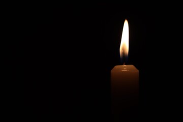 Candle black background of mourning funeral moment of silence	