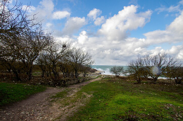 Fototapeta na wymiar gravel road towards the sea on a Sunny day