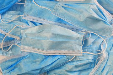 A large amount of used disposable masks. Hazardous waste. Coronavirus. Environment pollution