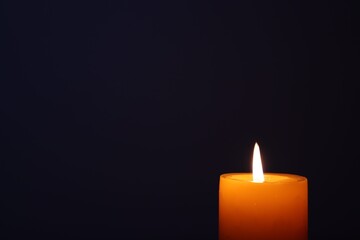 Candle black background of mourning funeral moment of silence	