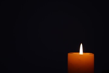 Candle black background of mourning funeral moment of silence	