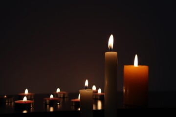 Candle black background of mourning funeral moment of silence	