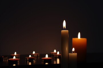 Candle black background of mourning funeral moment of silence	