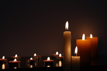 Candle black background of mourning funeral moment of silence	